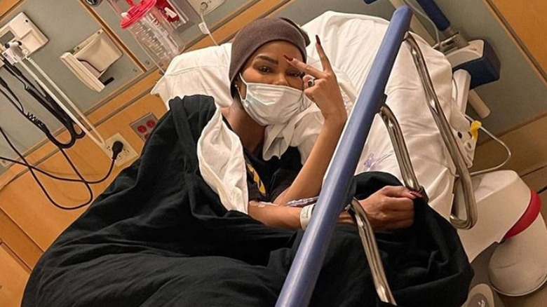 Teyana Taylor lies in a hospital bed