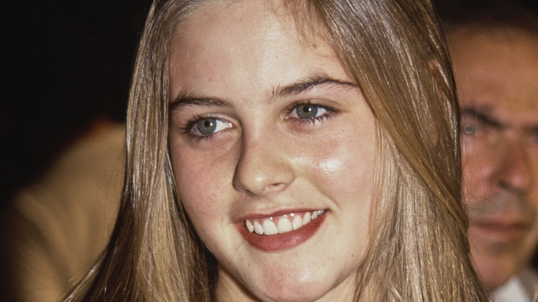 Young Alicia Silverstone smiling