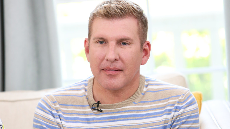 Todd Chrisley wearing a striped shirt
