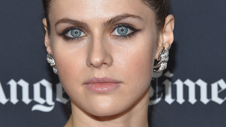 Alexandra Daddario wears smoky eye and silver earrings