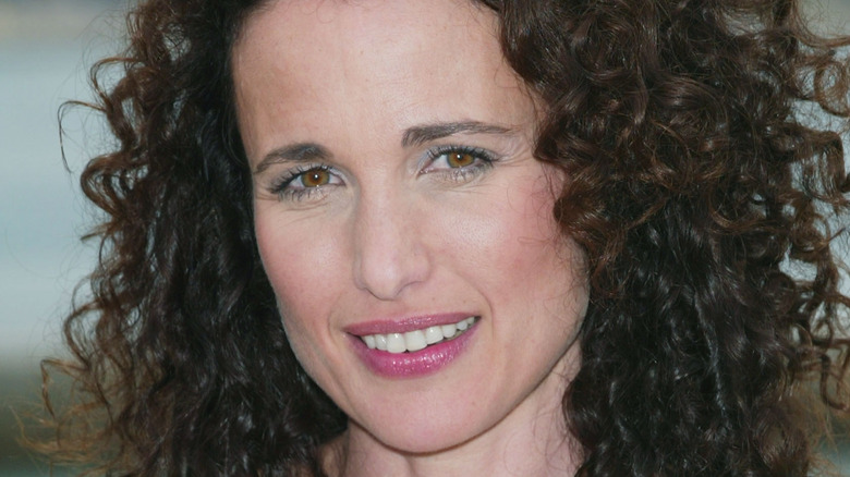 Andie MacDowell with pink lipstick and brown hair