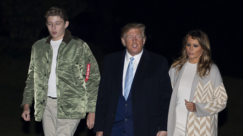 Barron, Donald and Melania Trump at an event 