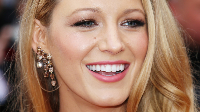 Blake Lively smiling on the red carpet