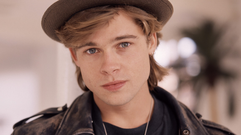Headshot of Brad Pitt in a hat