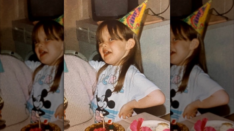 Young Nicola Coughlan wearing a birthday hat
