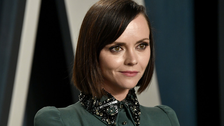 Christina Ricci poses in a green dress in 2020