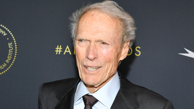 Clint Eastwood poses in a gray suit in 2020.