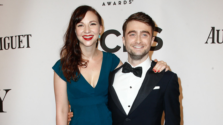 Daniel Radcliffe and Erin Darke pose side by side.