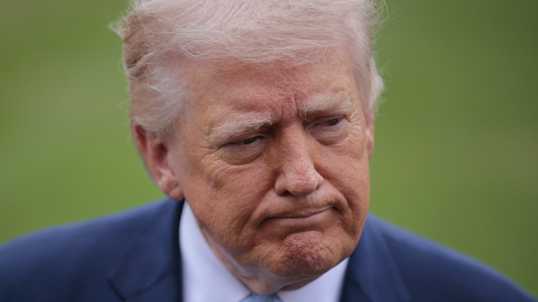 Donald Trump pictured puckering his chin.