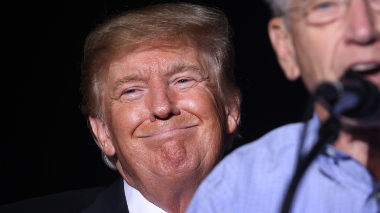 Donald Trump smiles at an audience in Des Moines in 2021.