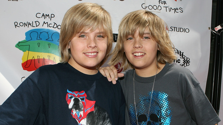 Dylan and Cole Sprouse smile at camera