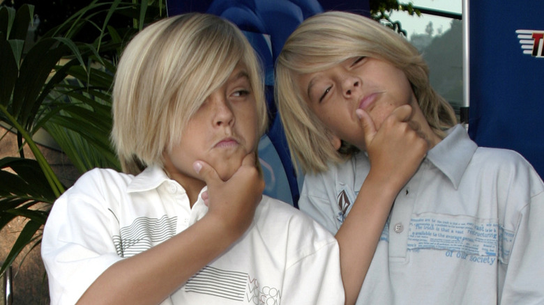 Cole and Dylan Sprouse posing at event