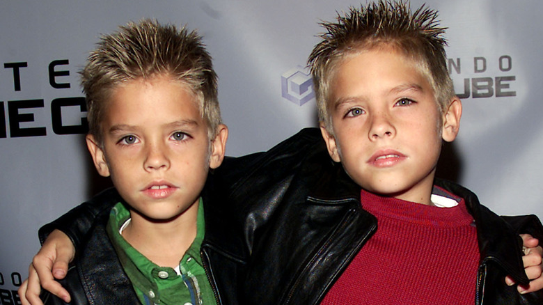 Dylan and Cole Sprouse looking at camera