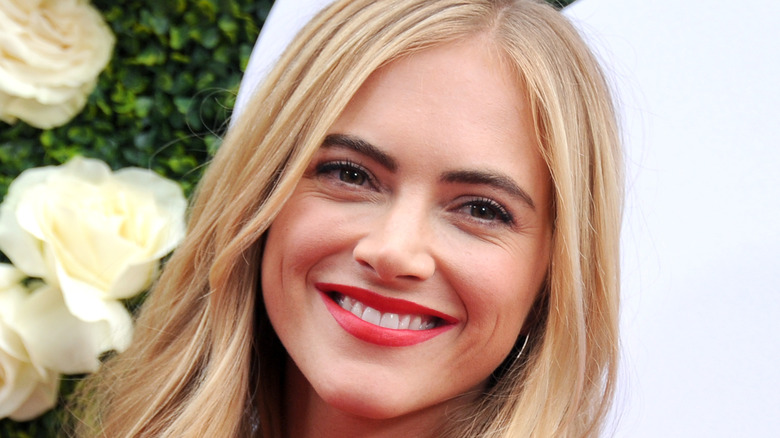 Emily Wickersham smiling for photos