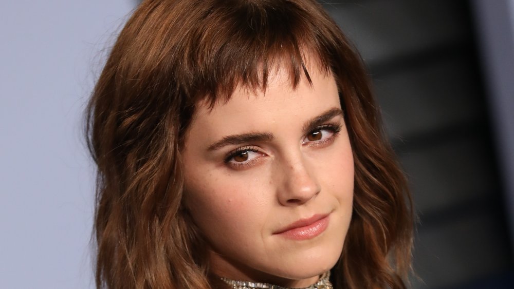 Emma Watson with short bangs, posing at the 2018 Vanity Fair Oscar Party