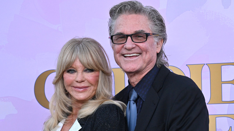Goldie Hawn and Kurt Russell posing together on red carpet