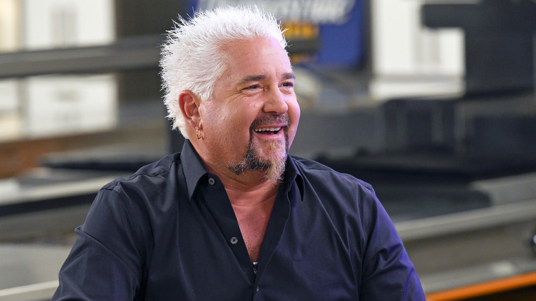 Guy Fieri looking into the distance