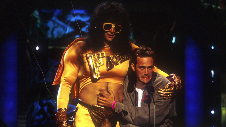 Luke Perry grabbing Howard Stern