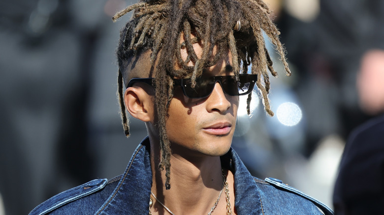 A closeup of a teenage Jaden Smith, smiling