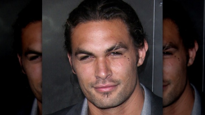 Jason Momoa half smiling