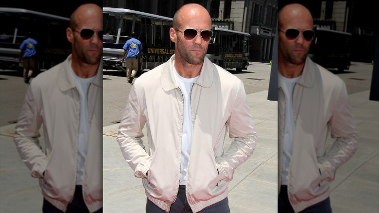 Jason Statham in a casual jacket and aviator sunglasses