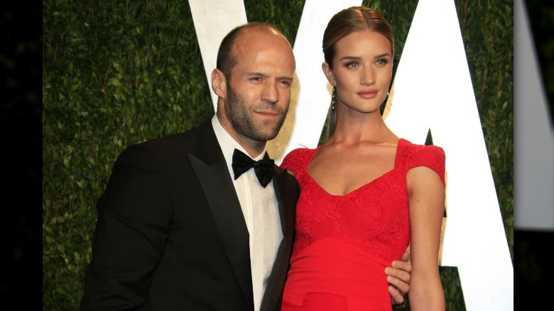 Jason Statham posing with Rosie Huntington-Whiteley