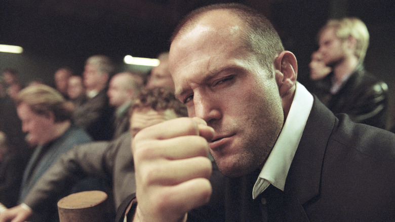 Jason Statham posing behind the scenes of Snatch
