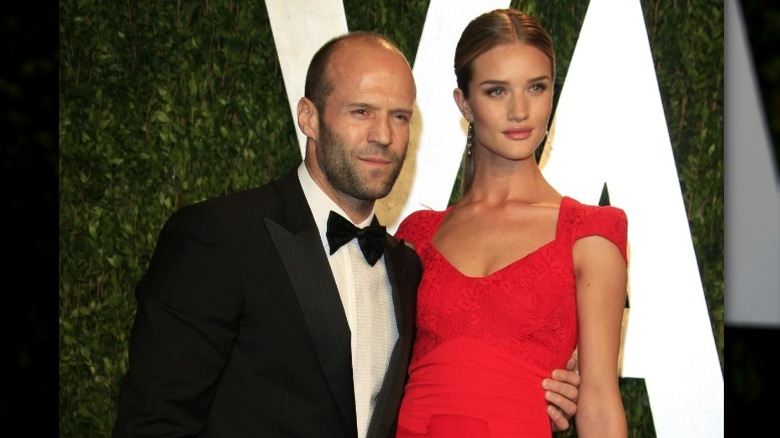Jason Statham posing with Rosie Huntington-Whiteley