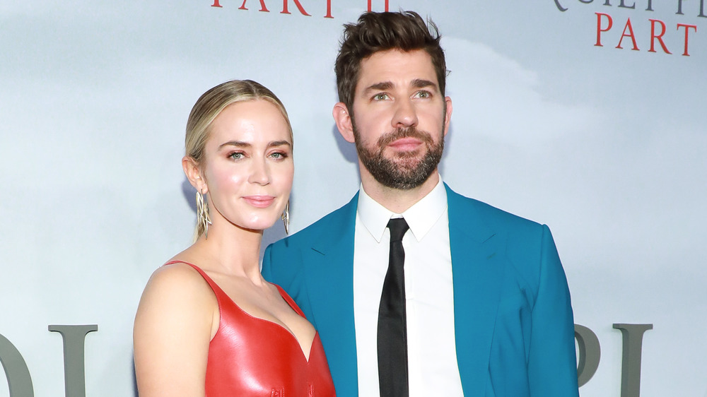 John Krasinski and wife Emily Blunt posing together on the red carpet