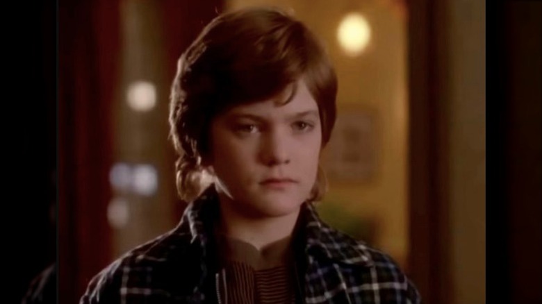 Young Joshua Jackson looking at camera