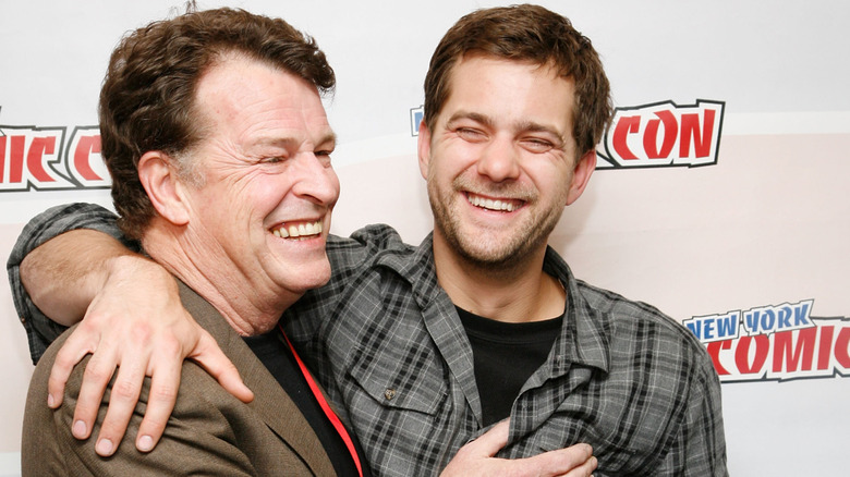 Joshua Jackson with John Noble, hugging