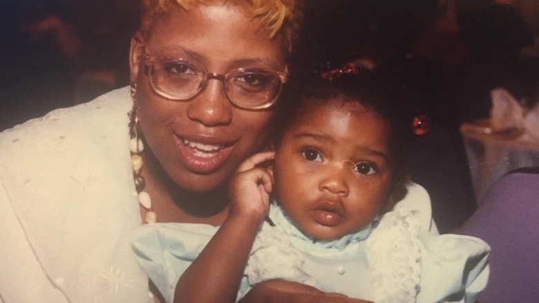 Keke Palmer's mother holding her as a baby
