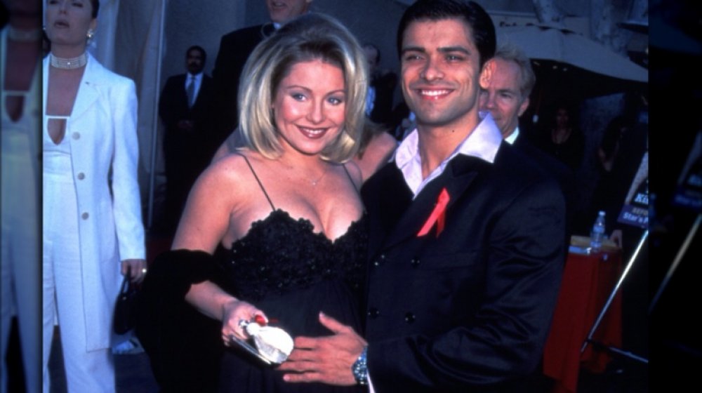 Kelly Ripa posing with Mark Consuelos in 1997