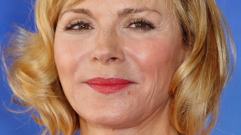 Kim Cattrall poses in a red lipstick