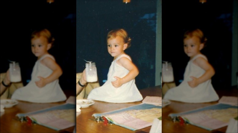 Leighton Meester as a baby sitting on a table