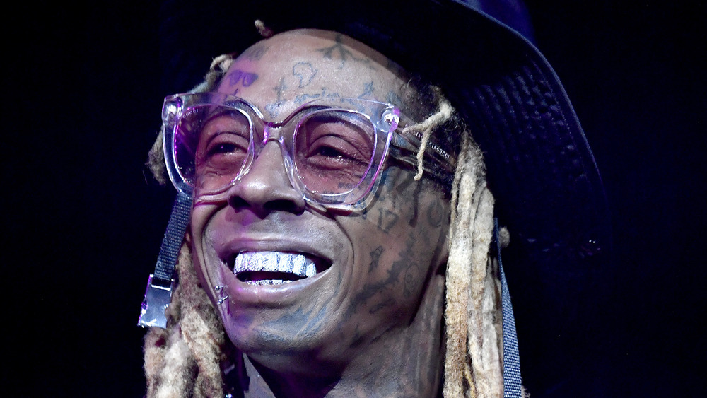 Lil Wayne smiling on stage