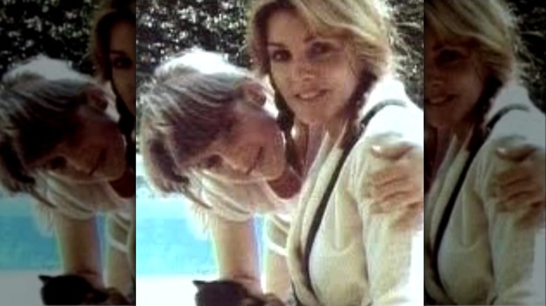 Lisa Marie Presley around 12 years old, with her mom and a cat