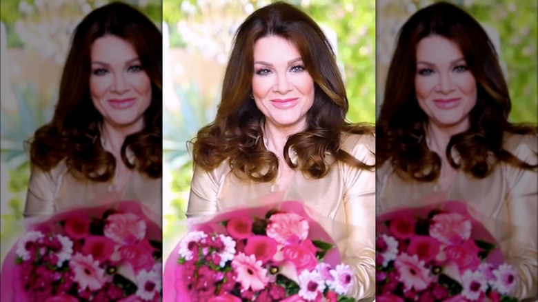 Lisa Vanderpump holding a bouquet of flowers
