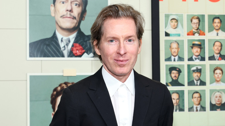 Wes  Anderson smiling in suit