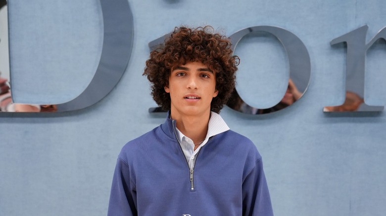 Levi McConaughey posing Dior logo