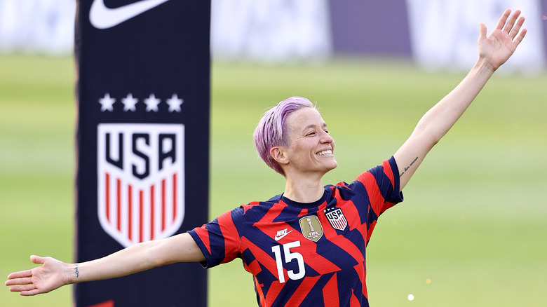Megan Rapinoe arms outstretched