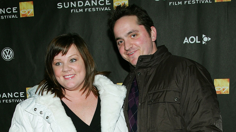 Melissa McCarthy, Ben Falcone smiling while arm-in-am at the Sundance Film Festival