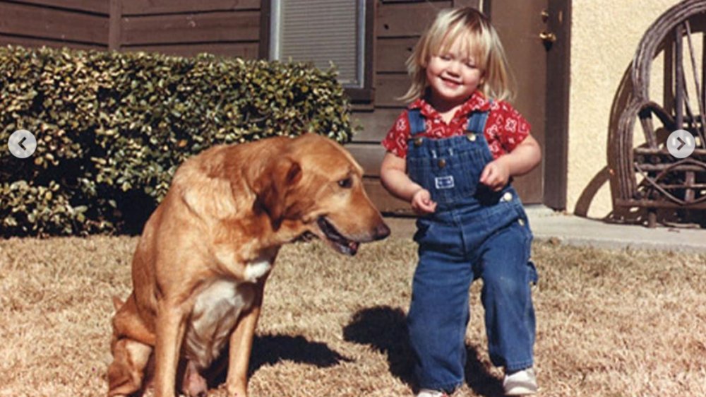 Miranda Lambert as a young girl with her dog 