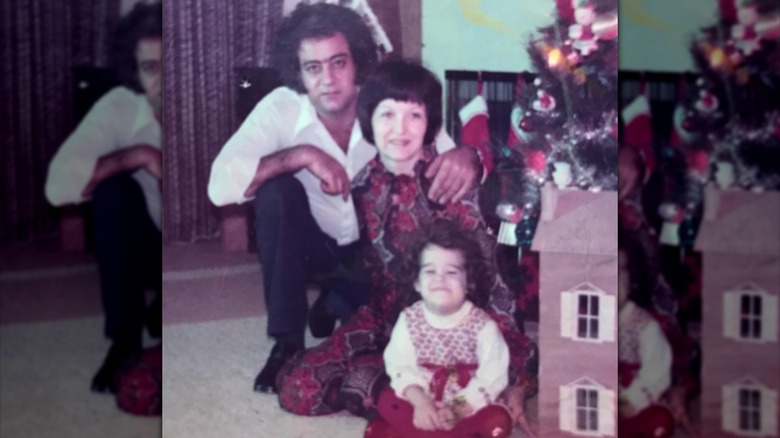 Young Natalie Suleman posing with her parents as a child