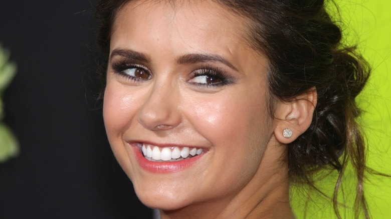 Nina Dobrev grinning