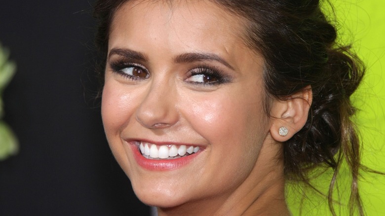 Nina Dobrev grinning