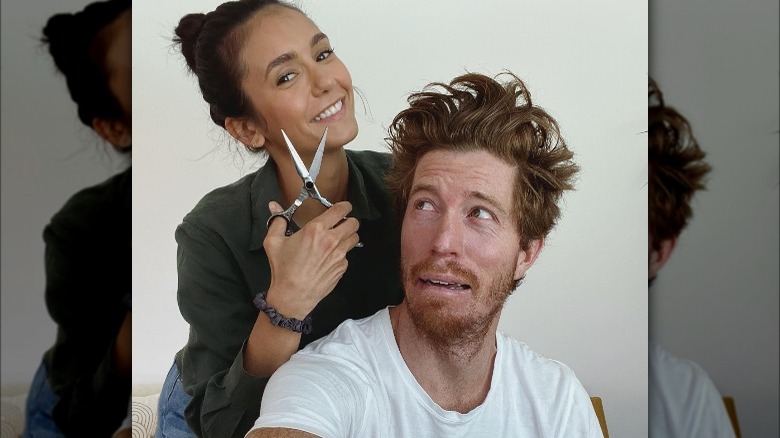 Nina Dobrev wields scissors over Shaun White