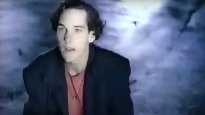 Paul Rudd in red shirt and coat