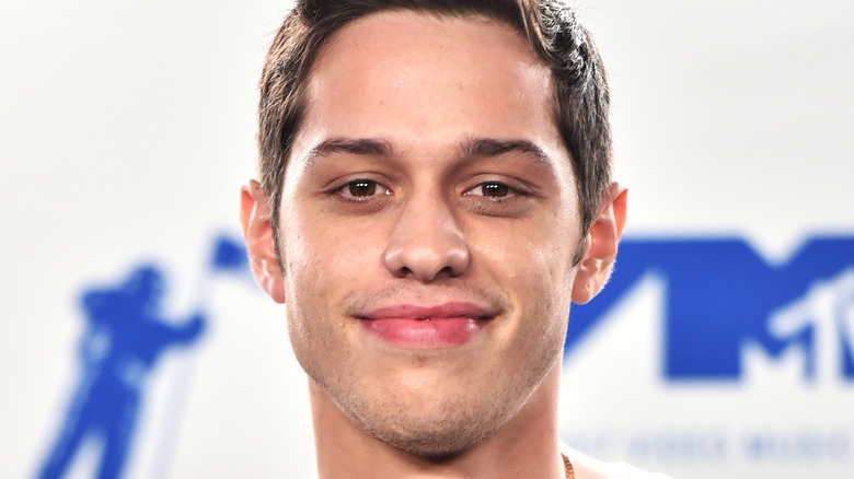 Pete Davidson smirking