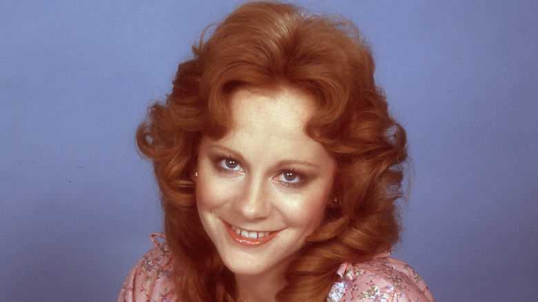 Reba McEntire smiling in glamour photo